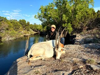 A hunter pictured with a Scimitar Oryx taken at BarBell Ranch in Sweetwater, TX.