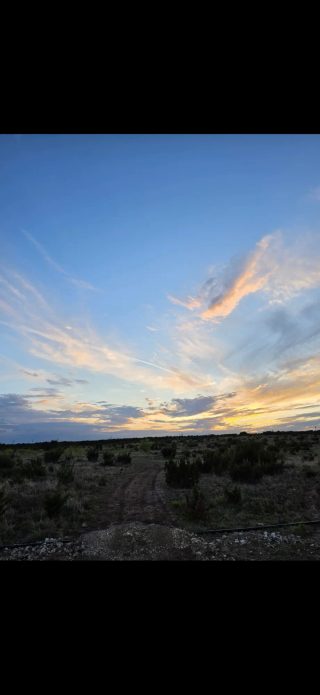Sunset light across the BarBell Ranch landscape in Sweetwater, TX, revealing the broad plains.