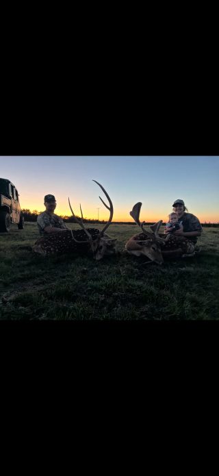 Hunters and their trophy Axis and follow bucks at BarBell Ranch in Sweetwater, Texas.