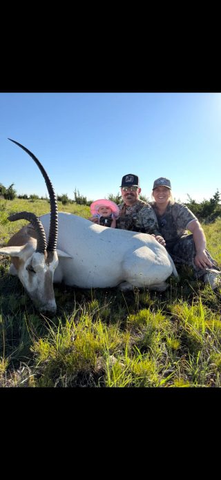 Scimitar oryx taken at BarBell Ranch in Sweetwater, TX, with family sharing the experience.