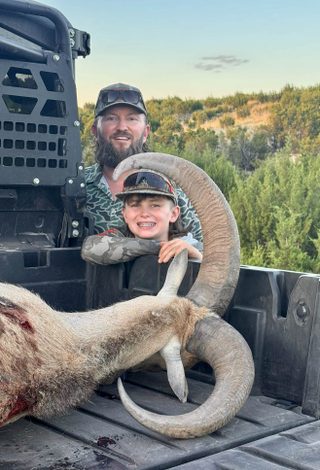 Father and son with a large Aoudad ram taken at BarBell Ranch in Sweetwater, TX.