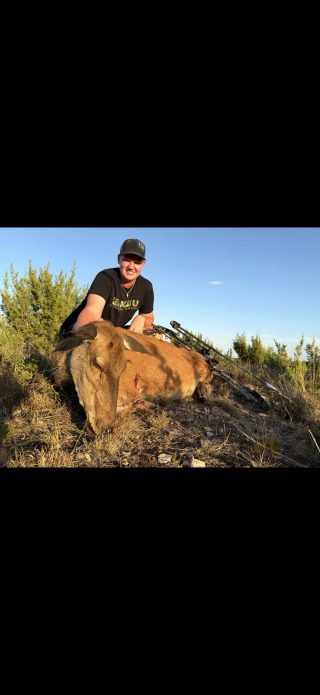 Hunter with a harvested Red Hind taken at BarBell Ranch in Sweetwater, TX.