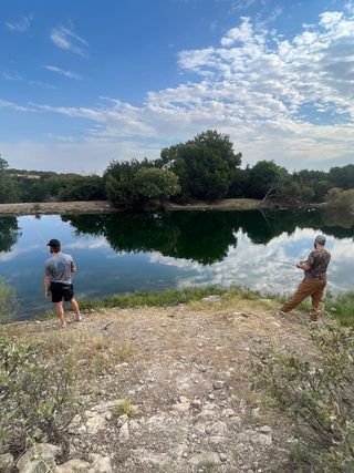 Hunters enjoy fishing a pond at BarBell Ranch in Sweetwater, TX.