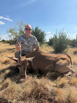 Hunter with a broken horn Eland taken at BarBell Ranch in Sweetwater, TX, showcasing the ranch's diverse offerings.