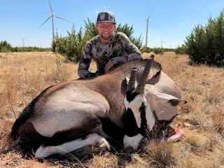 Hunter with a broken horn gemsbok taken at BarBell Ranch in Sweetwater, TX, set against a West Texas landscape.