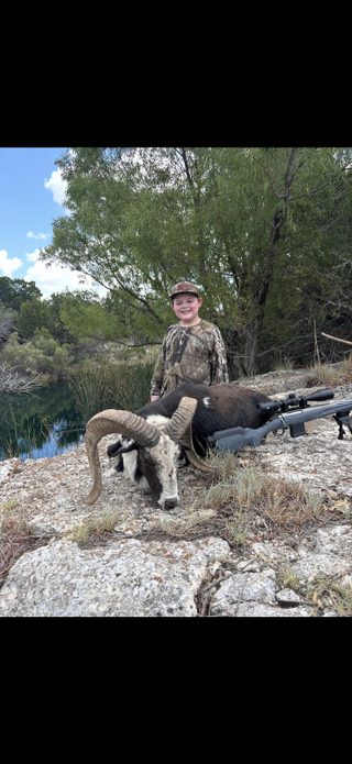 Young hunter with a Desert Paint Ram taken at BarBell Ranch in Sweetwater, TX.