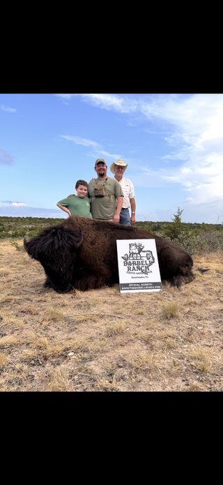 Father and son with their harvested bison from BarBell Ranch in Sweetwater, TX.
