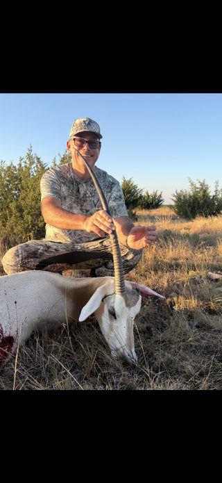Hunter with a successful broken horn Scimitar Oryx hunt at BarBell Ranch in Sweetwater, TX.